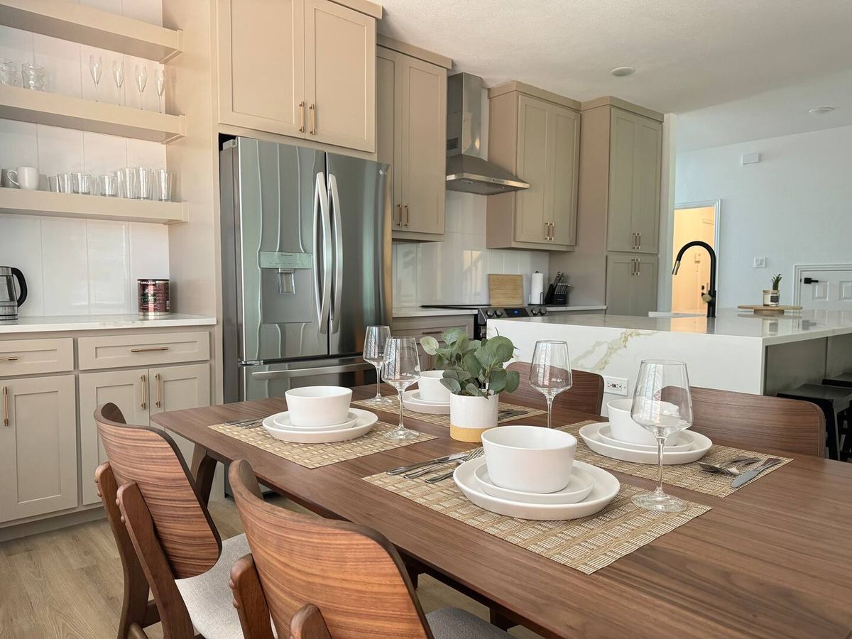 Kitchen with open shelving and stainless appliances