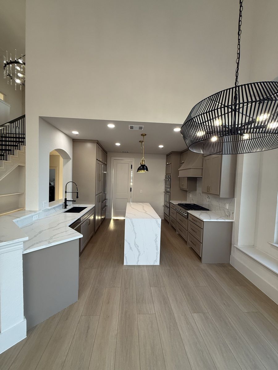 Custom kitchen open to the stair hall