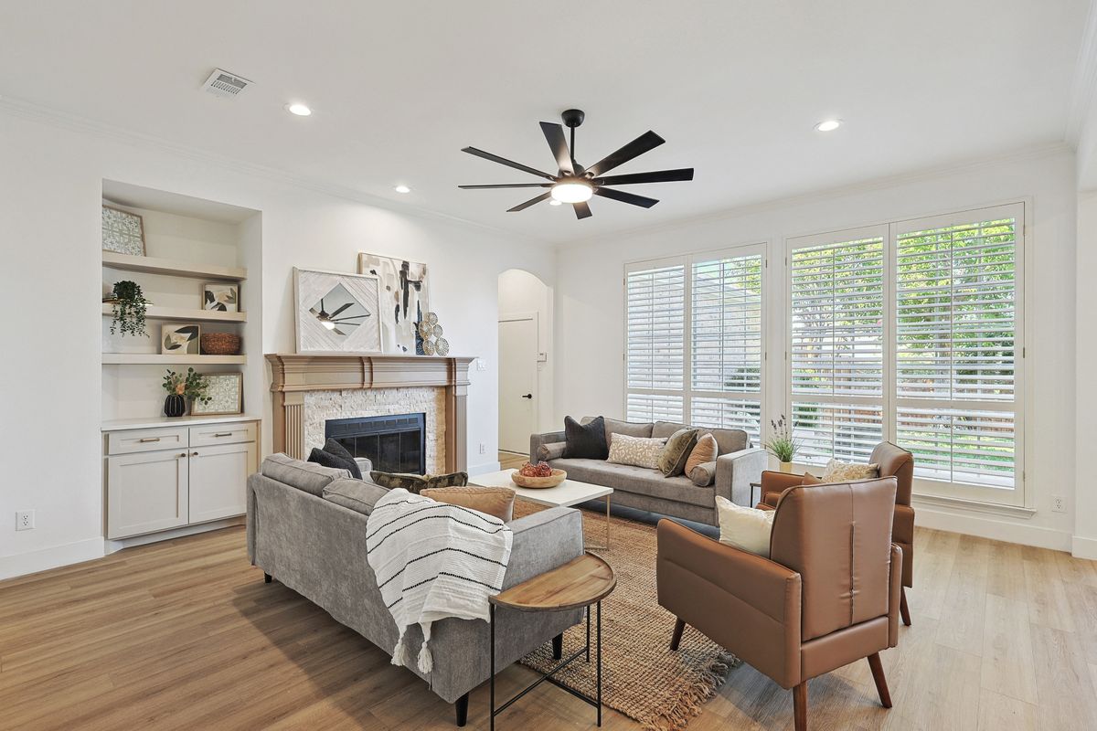 Living room with built-ins and shutters