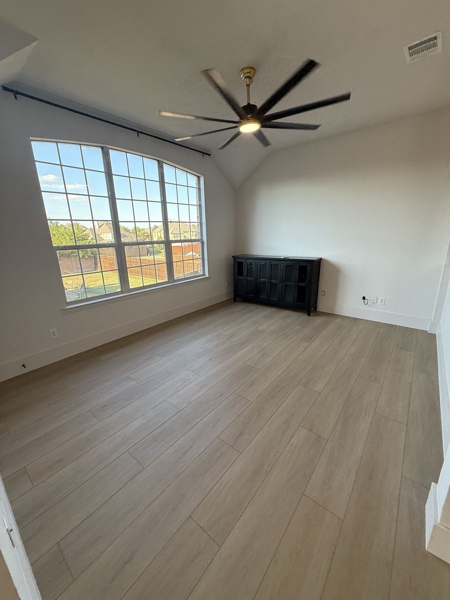 Great room with slate fireplace and window wall