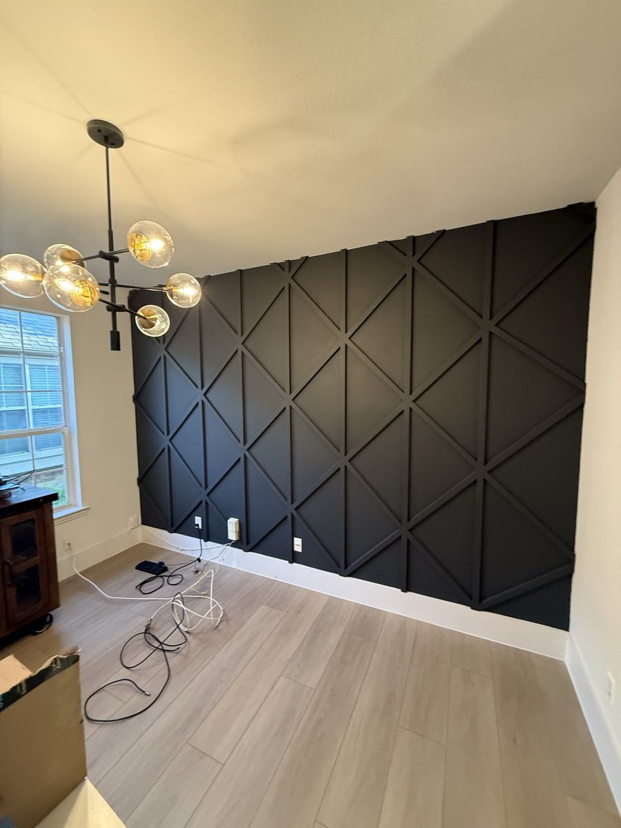 Dining room with black board-and-batten wall