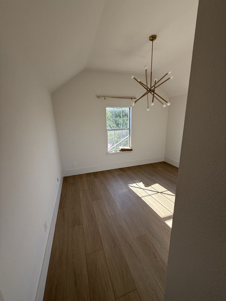 Bedroom with brass chandelier