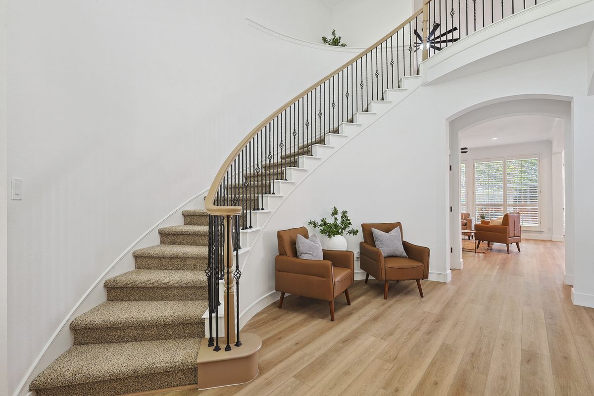Curved staircase with refinished treads