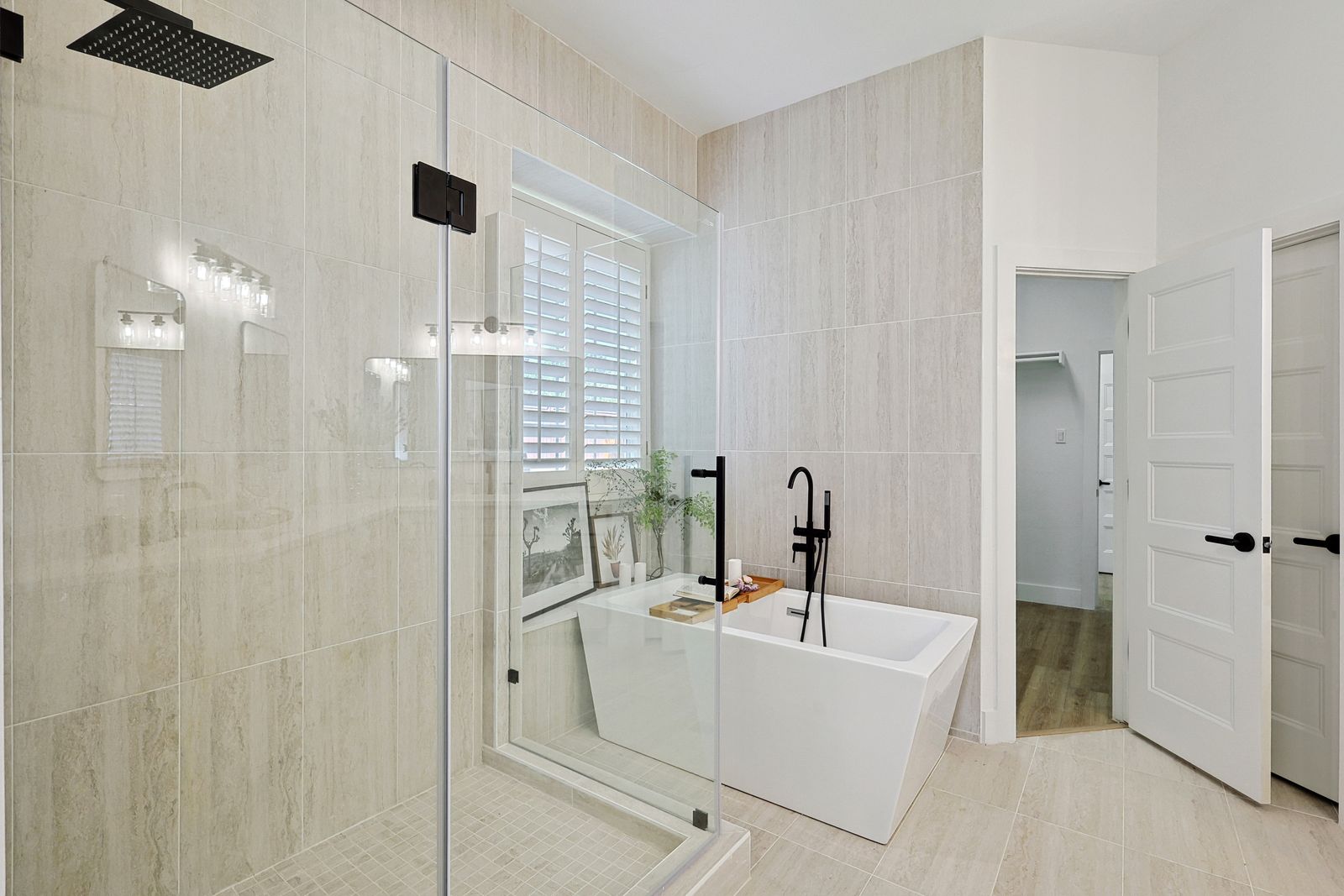 Renovated primary bathroom with freestanding tub