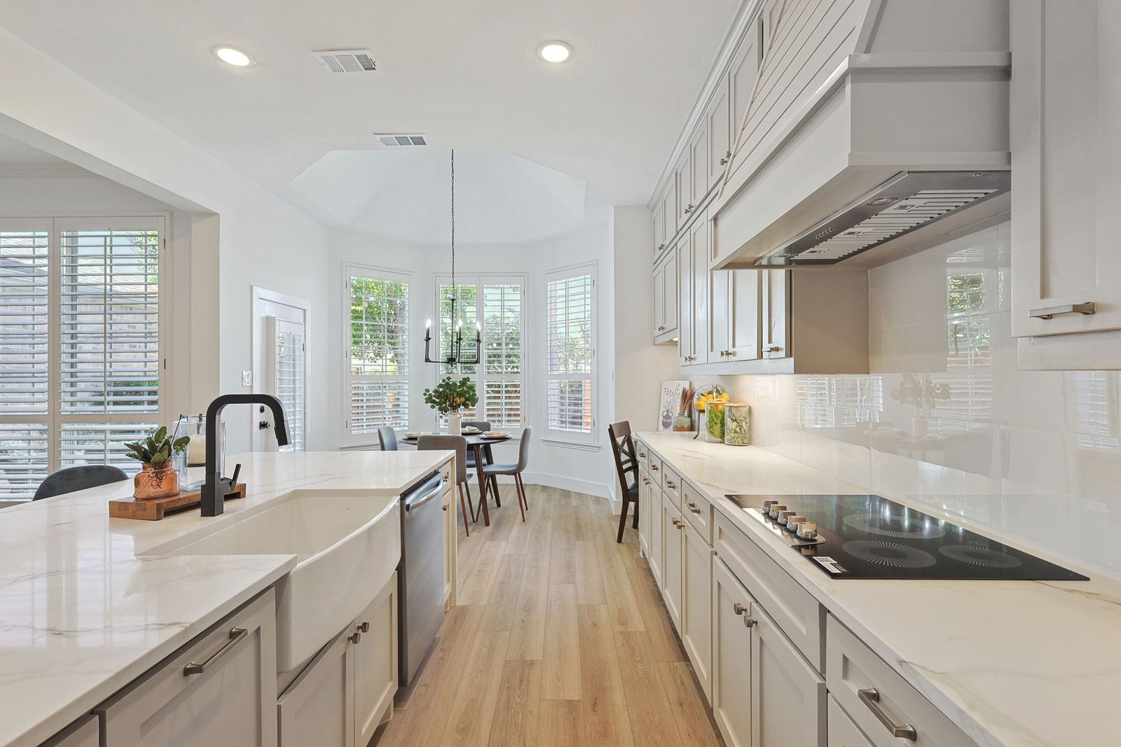 Renovated white kitchen with quartz counters