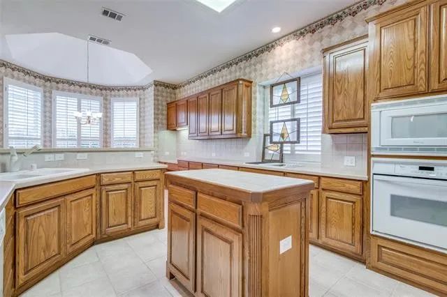 Original kitchen with dated oak cabinets