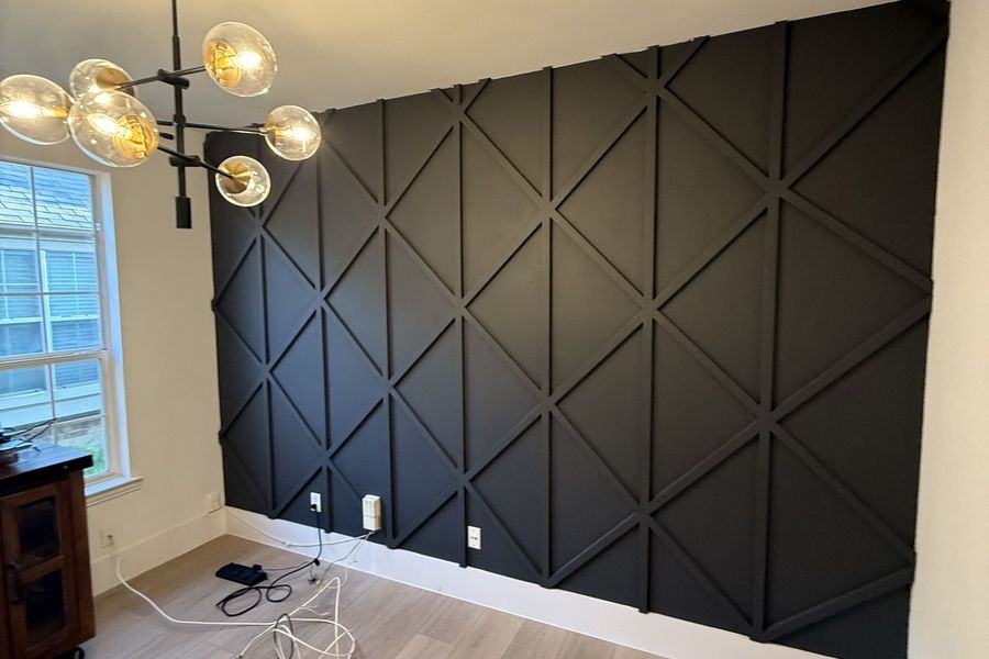 Black board-and-batten dining room accent wall