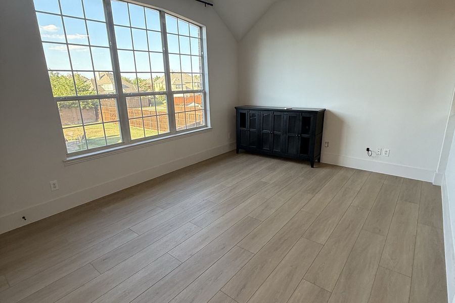 Great room with slate fireplace and window wall